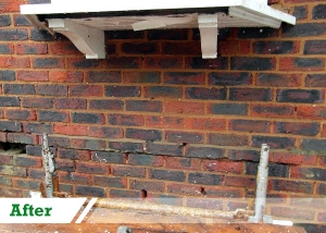 Bitumen removal from brick wall completed by UK Performance Restoration, London UK.