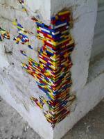 deteriorating brickwork patched with Lego bricks